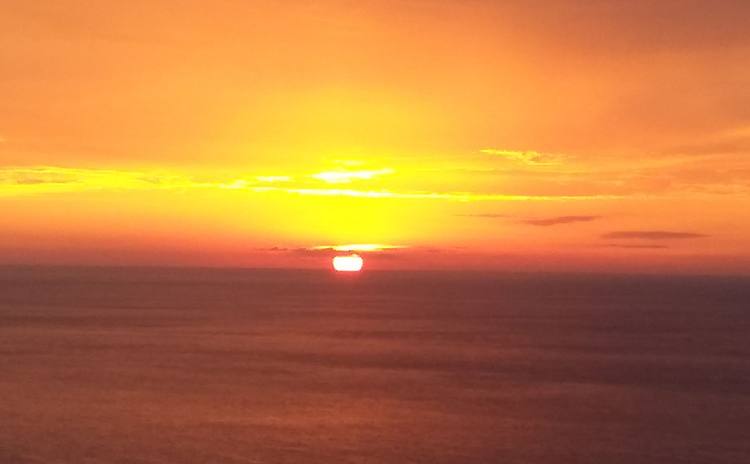 Orange sunset over the sea in Corfu