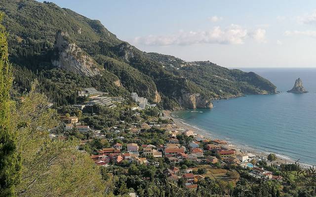 Hillside village above a bay in Corfu