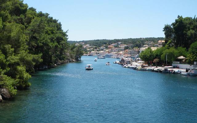 Tree-lined waterway in Corfu