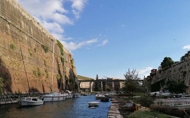 Old fortress walls above a harbour