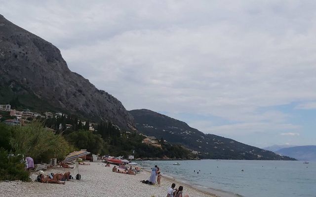 Ipsos Beach with the mountains rising behind