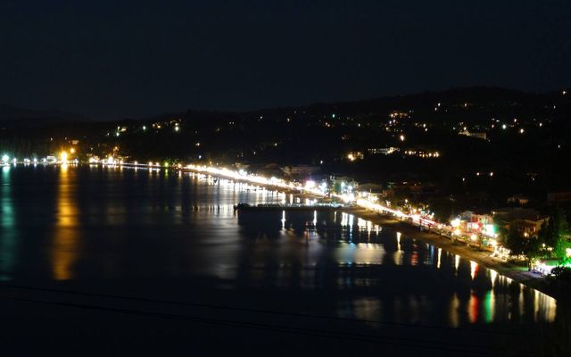 Ipsos bay and its seafront lit up at night